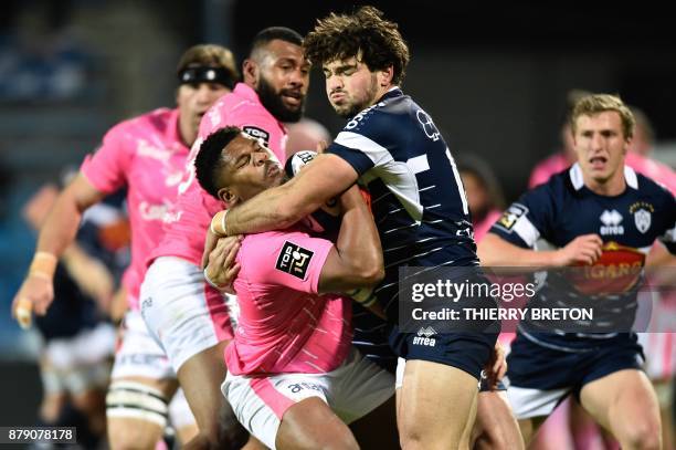 Stade Francais's Jonathan Danty vies with Agen's Julien Heriteau during the French Top 14 rugby union match between SU Agen and Stade Francais on...