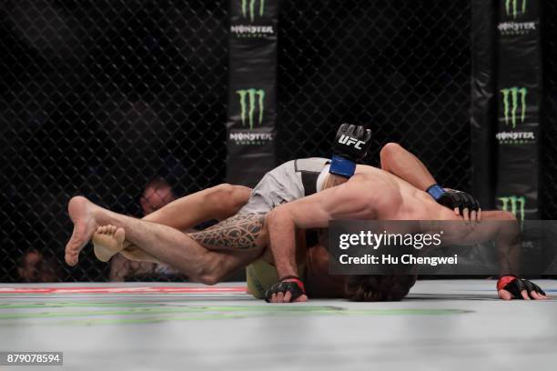 Zabit Magomedsharipov of Russia, up fights with Sheymon Moraes, down, during the UFC Fight Night at Mercedes-Benz Arena on November 25, 2017 in...
