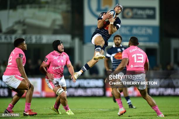 Agen's Clement Laporte catches the ball during the French Top 14 rugby union match between SU Agen and Stade Francais on November 25, 2017 at...