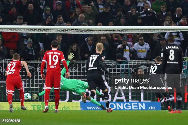 Thorgan Hazard of Moenchengladbach scores a penalty goal to make it 1:0 during the Bundesliga match between Borussia Moenchengladbach and FC Bayern...