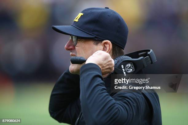 Jim Harbaugh head coach of the Michigan Wolverines looks on in the first half against the Ohio State Buckeyes on November 25, 2017 at Michigan...