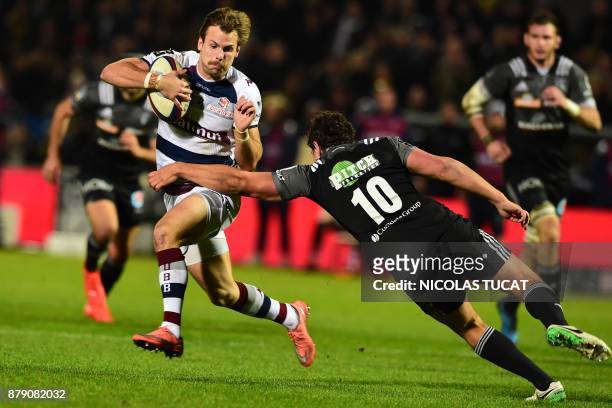 Bordeaux-Begles' French scrumhalf Yann Lesgourgues runs with the ball during the French Top 14 rugby union match between Bordeaux-Begles and Brive on...