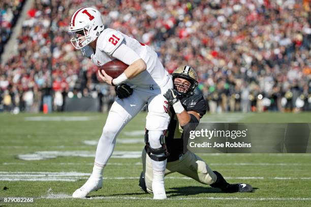 Markus Bailey of the Purdue Boilermakers tackles Richard Lagow of the Indiana Hoosiers in the first quarter of a game at Ross-Ade Stadium on November...