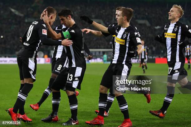 Thorgan Hazard of Moenchengladbach celebrates with his team mates after he scored to make it 1:0 during the Bundesliga match between Borussia...