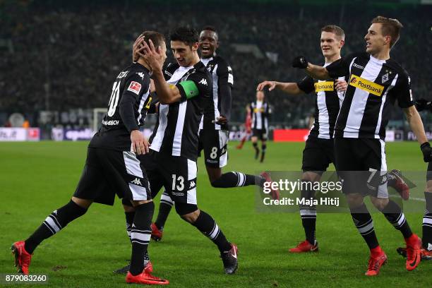 Thorgan Hazard of Moenchengladbach celebrates with his team mates after he scored to make it 1:0 during the Bundesliga match between Borussia...