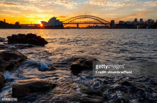 icons of sydney harbour at sunset - sydney harbour stock pictures, royalty-free photos & images