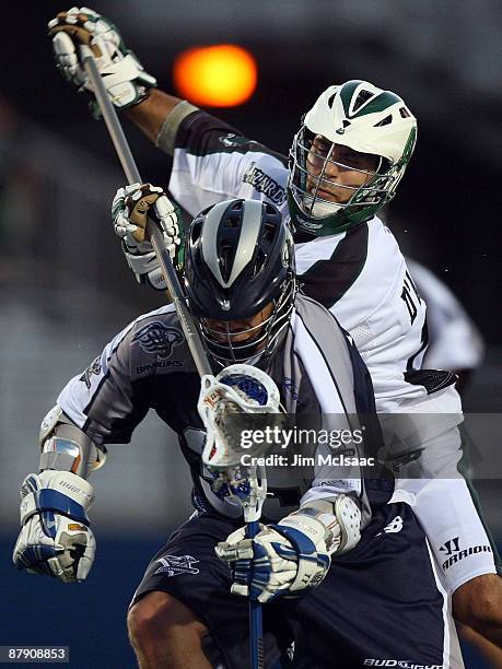 Frank D'Agostino of the Long Island Lizards defends against Kevin Huntley of the Washington Bayhawks during their Major League Lacrosse game at...