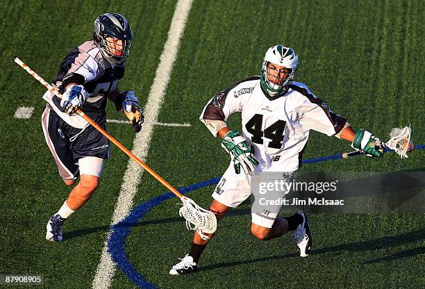 Kyle Hartzell of the Washington Bayhawks defends against Matt Zash of the Long Island Lizards during their Major League Lacrosse game at Shuart...
