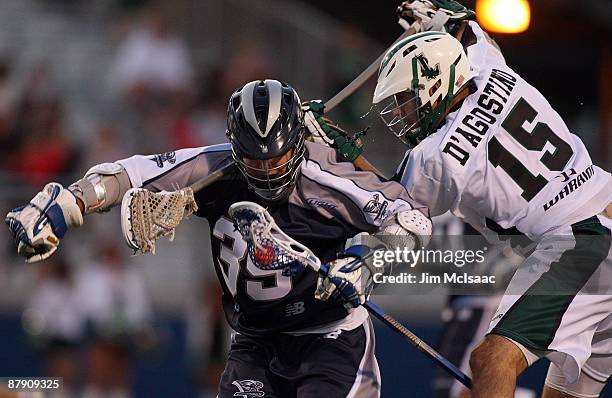 Frank D'Agostino of the Long Island Lizards defends against Kevin Huntley of the Washington Bayhawks during their Major League Lacrosse game at...