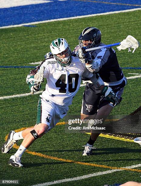 Ronnie Staines of the Washington Bayhawks defends against Matt Danowski of the Long Island Lizards during their Major League Lacrosse game at Shuart...