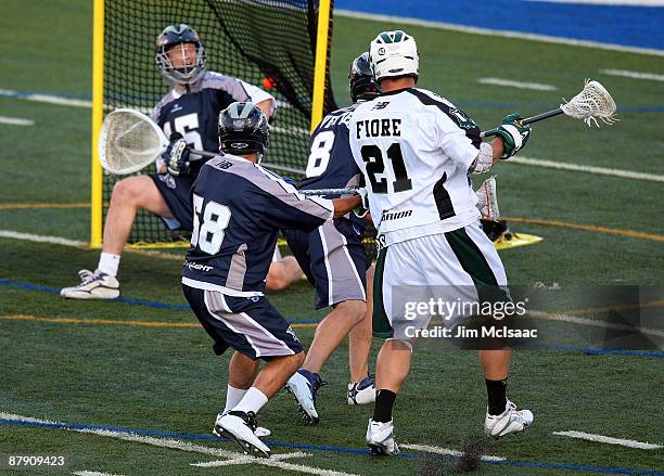 Chris Fiore of the Long Island Lizards scores agoal past Chris Garrity of the Washington Bayhawks during their Major League Lacrosse game at Shuart...