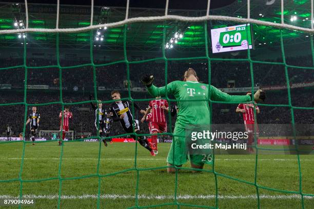 Thorgan Hazard of Moenchengladbach about to take a penally past goalkeeper Sven Ulreich of Bayern Muenchen that results in a goal to make it 1:0...