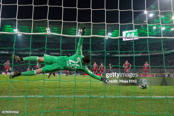 Thorgan Hazard of Moenchengladbach about to take a penally past Sven Ulreich of Bayern Muenchen that results in a goal to make it 1:0 during the...