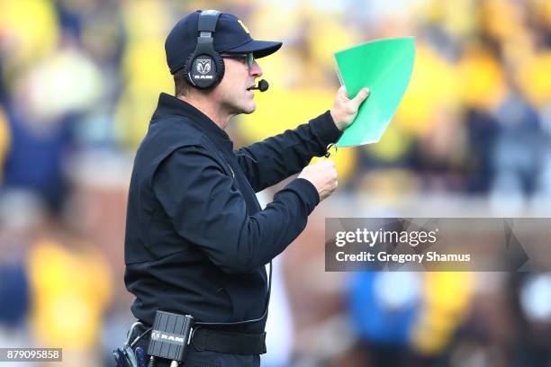 Jim Harbaugh head coach of the Michigan Wolverines looks on in the first half against the Ohio State Buckeyes on November 25, 2017 at Michigan...