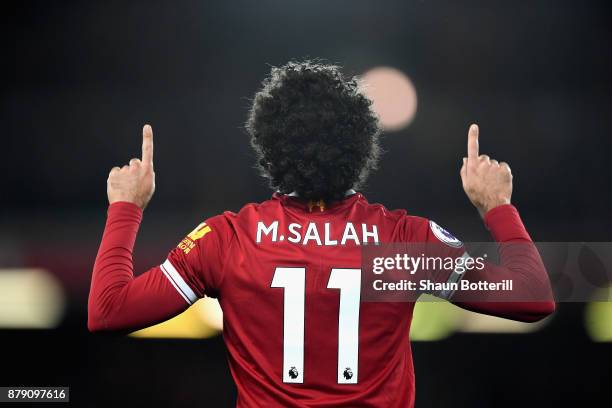 Mohamed Salah of Liverpool celebrates scoring his sides first goal during the Premier League match between Liverpool and Chelsea at Anfield on...