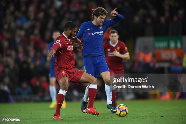 Joe Gomez of Liverpool tackles Marcos Alonso of Chelsea during the Premier League match between Liverpool and Chelsea at Anfield on November 25, 2017...