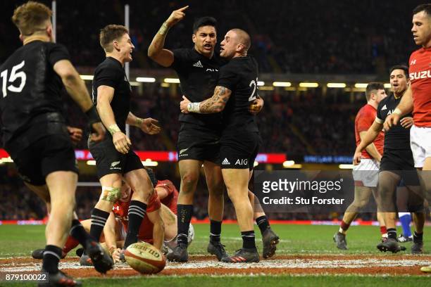 Rieko Ioane of New Zealand celebrates scoring his sides fifth try with TJ Perenara of New Zealand during the International match between Wales and...