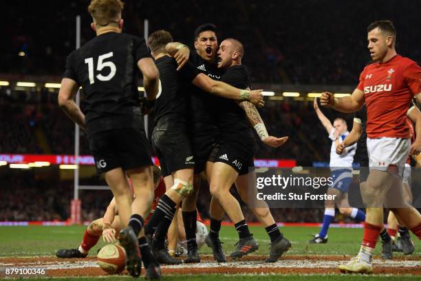 Rieko Ioane of New Zealand All Blacks celebrates his second try with TJ Perenara during the International match between Wales and New Zealand at...