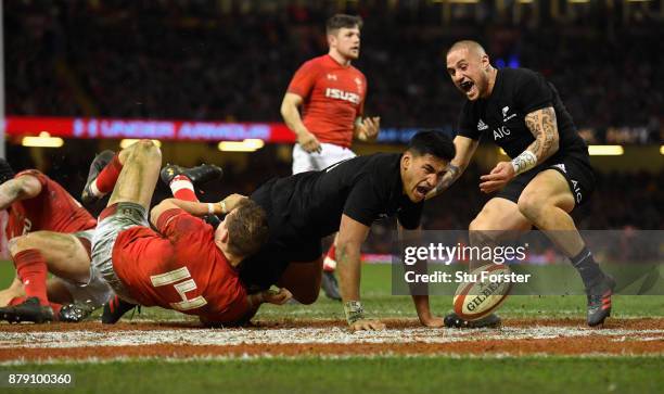 Rieko Ioane of New Zealand All Blacks celebrates his second try with TJ Perenara during the International match between Wales and New Zealand at...