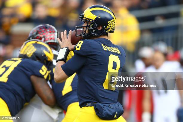 John O'Korn of the Michigan Wolverines throws the ball first half against the Ohio State Buckeyes on November 25, 2017 at Michigan Stadium in Ann...