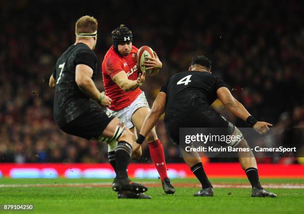 Wales' Leigh Halfpenny under pressure from New Zealand's Patrick Tuipulotu during the 2017 Under Armour Series Autumn International match between...