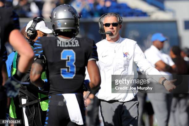 Mike Norvell, head coach of the Memphis Tigers talks with Anthony Miller of the Memphis Tigers against the East Carolina Pirates on November 25, 2017...