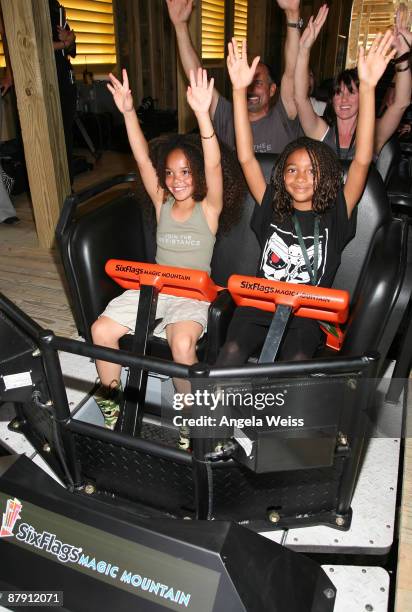 Jadagrace, Juliette, Michael Papajohn and Paula Papajohn attend the inaugural launch of the new wooden coaster Terminator Salvation: The Ride at Six...