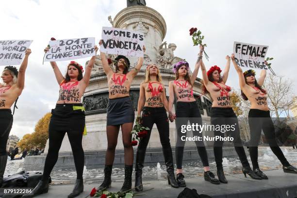 Activists from women's rights movement Femen, including leader Inna Shevchenko , stand topless while holding signs on the Place de la Republic in...