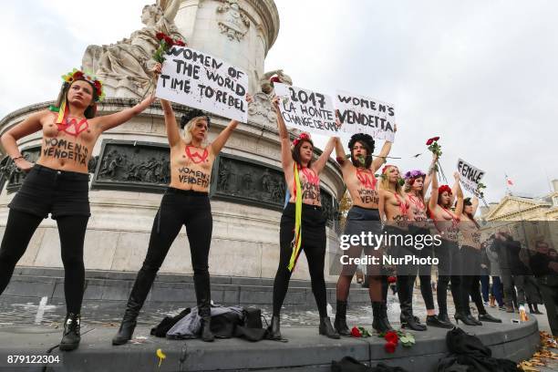 Activists from women's rights movement Femen, including leader Inna Shevchenko , stand topless while holding signs on the Place de la Republic in...