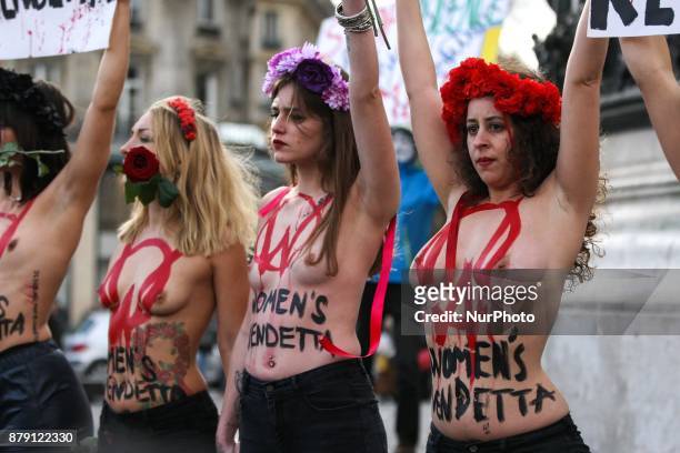 Activists from women's rights movement Femen, including leader Inna Shevchenko , stand topless while holding signs on the Place de la Republic in...