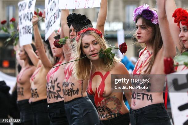 Activists from women's rights movement Femen, including leader Inna Shevchenko , stand topless while holding signs on the Place de la Republic in...