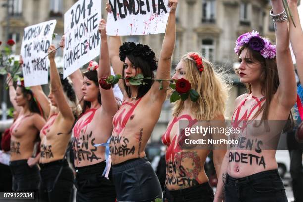 Activists from women's rights movement Femen, including leader Inna Shevchenko , stand topless while holding signs on the Place de la Republic in...