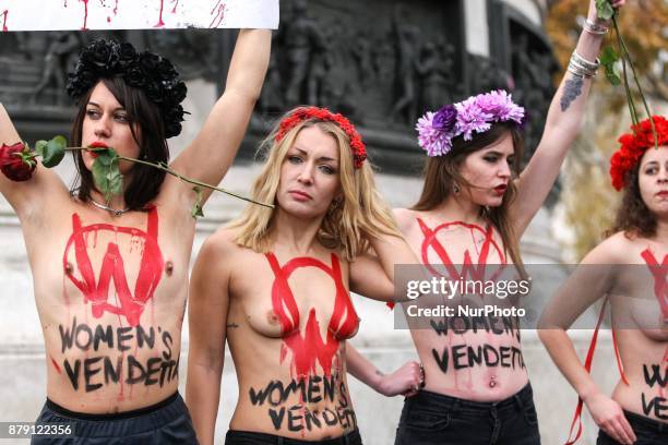 Activists from women's rights movement Femen, including leader Inna Shevchenko , stand topless while holding signs on the Place de la Republic in...