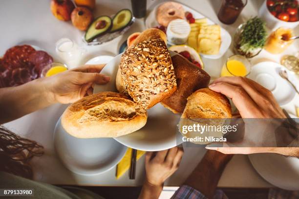 breakfast table with plate of bread buns - breakfast stock pictures, royalty-free photos & images