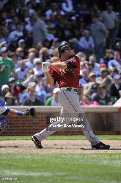 Lance Berkman of the Houston Astros connects for a home run in the eighth inning against the Chicago Cubs on May 16, 2009 at Wrigley Field in...