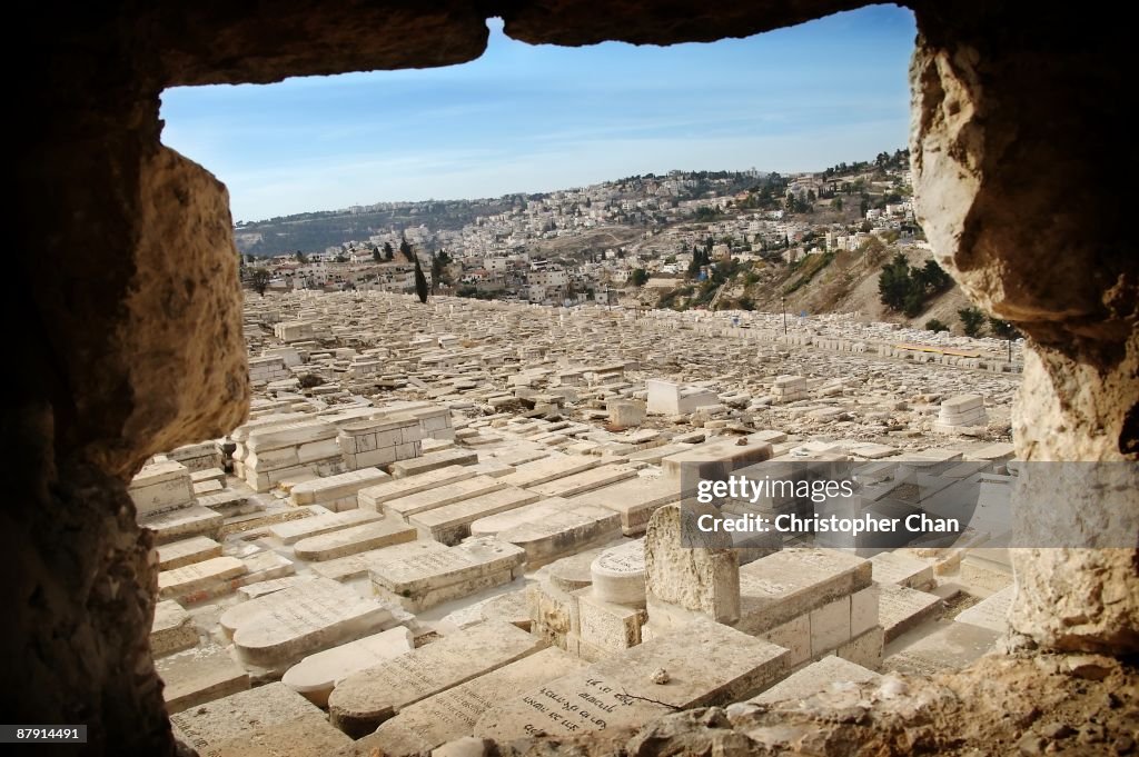 Ancient cemetary framed through a natural window