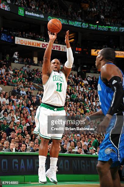 Glen Davis of the Boston Celtics shoots a jump shot against Dwight Howard of the Orlando Magic in Game Five of the Eastern Conference Semifinals...