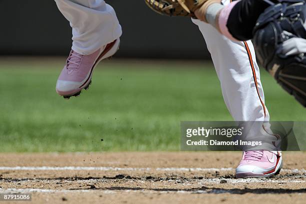 Detail view of the pink spikes that secondbaseman Brian Roberts of the Baltimore Orioles wears as he leads off the bottom of the first inning of a...