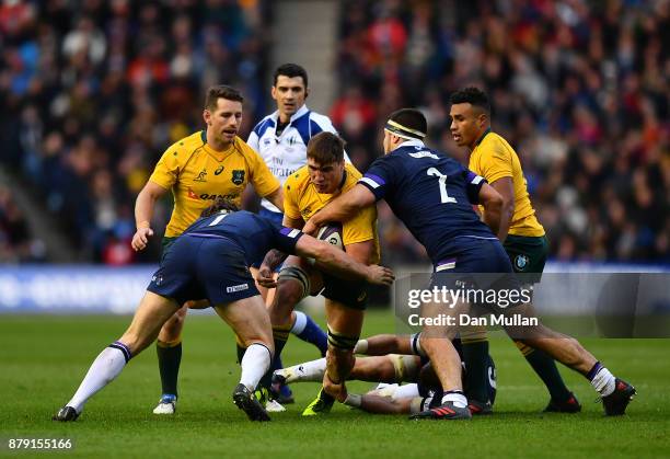 Sean McMahon of Australia is tackled by Hamish Watson and Stuart McInally of Scotland during the International match between Scotland and Australia...