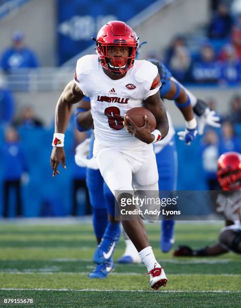 Lamar Jackson of the Louisville Cardinals runs with the ball against the Kentucky Wildcats during the game at Commonwealth Stadium on November 25,...