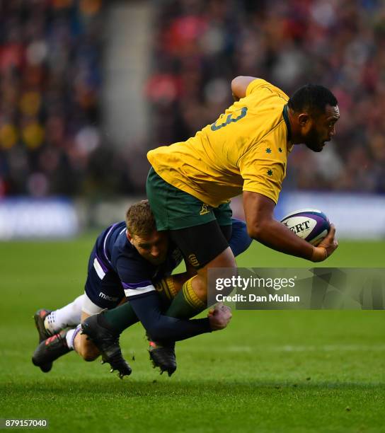 Sekope Kepu of Australia is tackled by Finn Russell of Scotland during the International match between Scotland and Australia at Murrayfield Stadium...