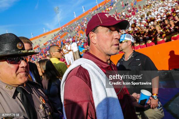 Florida State Seminoles head coach Jimbo Fisher is escorted off the field following the game between the Florida State Seminoles and the Florida...