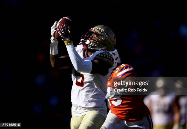 Ermon Lane of the Florida State Seminoles hauls in a 39-yard reception during the second half of the game against the Florida Gators at Ben Hill...