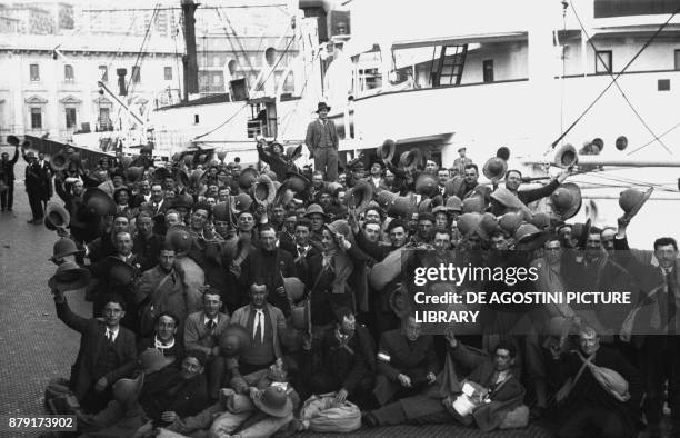 Soldiers waiting to embarking on the Gabbiano ship, February 28 Genoa port, Italy, 20th century.