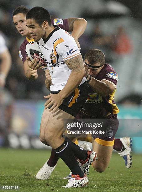 Dene Halatau of the Tigers is tackled during the round 11 NRL match between the Wests Tigers and the Brisbane Broncos at Campbelltown Sports Stadium...