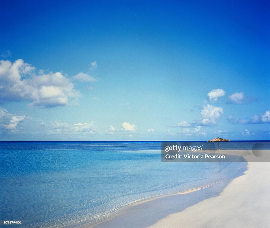 Antigua, Jumby Bay, umbrella on beach