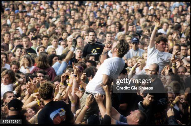 Deftones, Chino Moreno, crowdsurfing while performing, Pukkelpop Festival, Hasselt, Belgium, 29th August 1998.