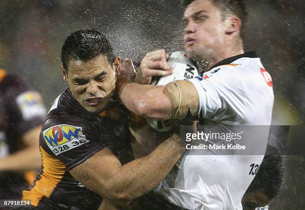 Ben Te'o of the Broncos puts a big hit on Corey Payne of the Tigers during the round 11 NRL match between the Wests Tigers and the Brisbane Broncos...