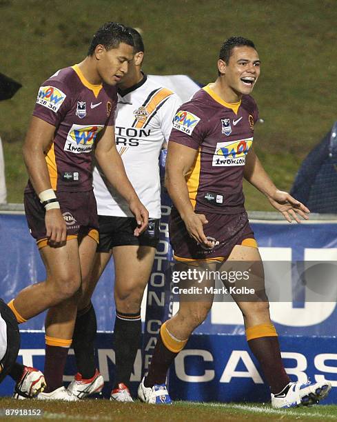 Ben Te'o of the Broncos celebrates after scoring a try during the round 11 NRL match between the Wests Tigers and the Brisbane Broncos at...