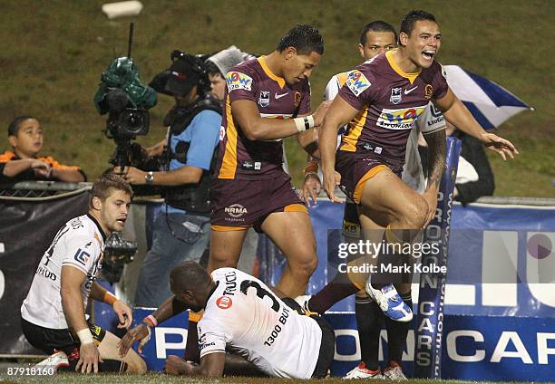 Ben Te'o of the Broncos celebrates after scoring a try during the round 11 NRL match between the Wests Tigers and the Brisbane Broncos at...